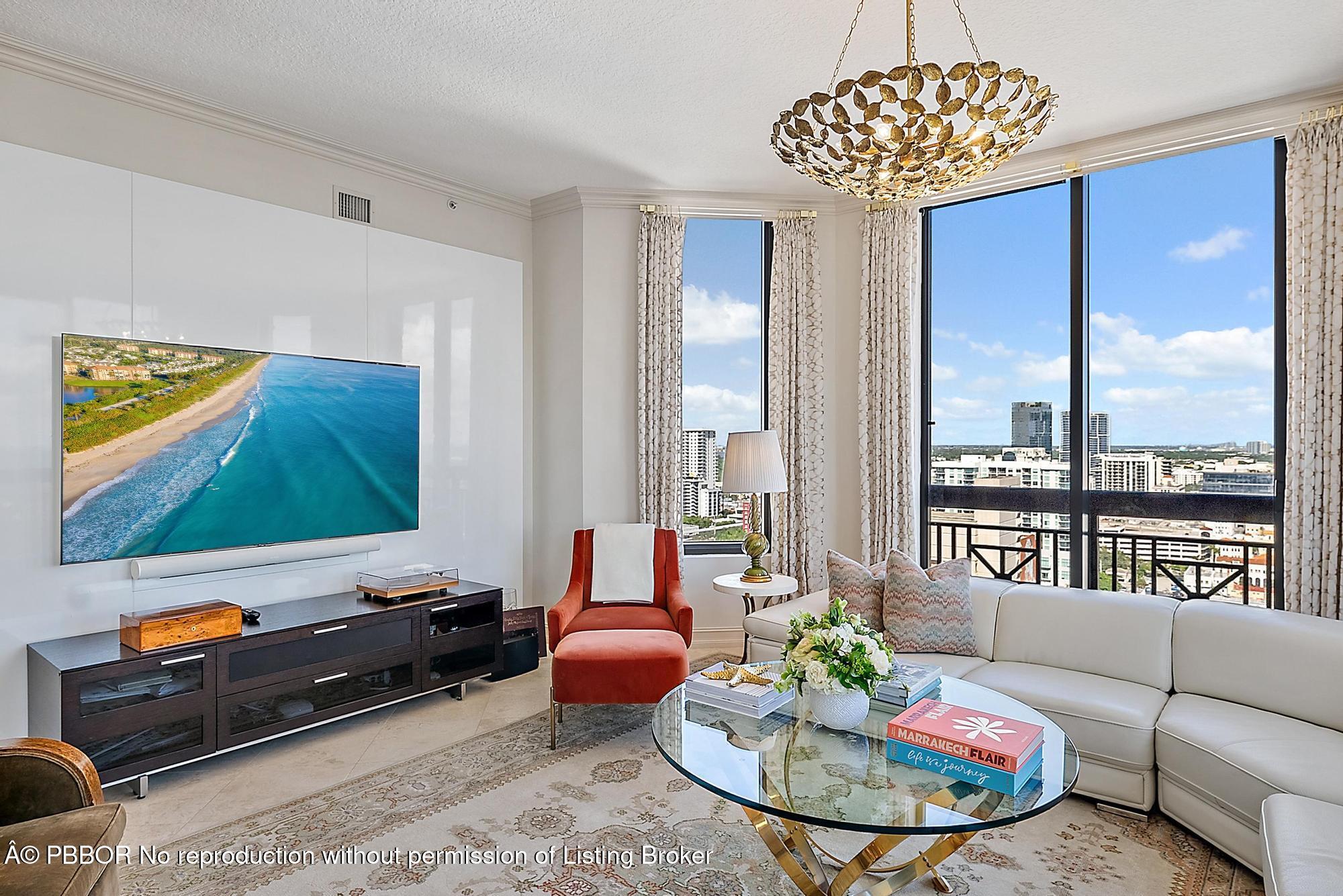 701 South Olive Avenue, Unit 2012 PH West Palm Beach, FL 33401 - Photo 8 of 42 a living room with furniture and a flat screen tv