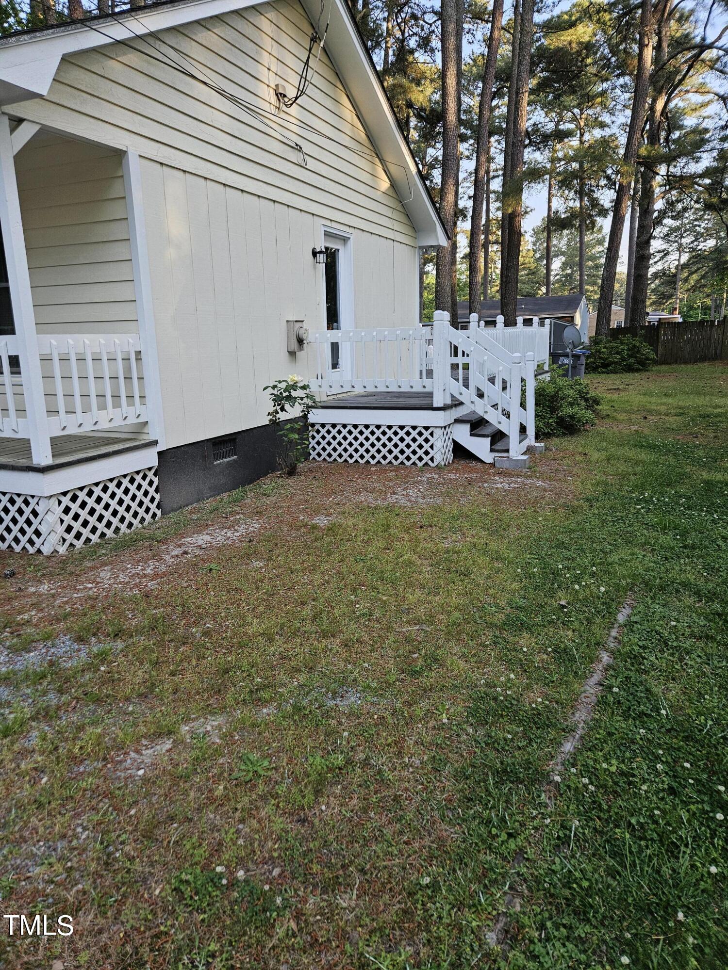 1629 Beverly Road Rocky Mount, NC 27801 - Photo 5 of 13 a view of a house with backyard and sitting area