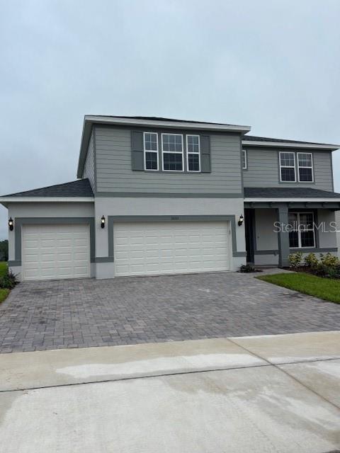 5095 Rising Rdg Drive Mount Dora, FL 32757 - Photo 1 of 1 a front view of a house