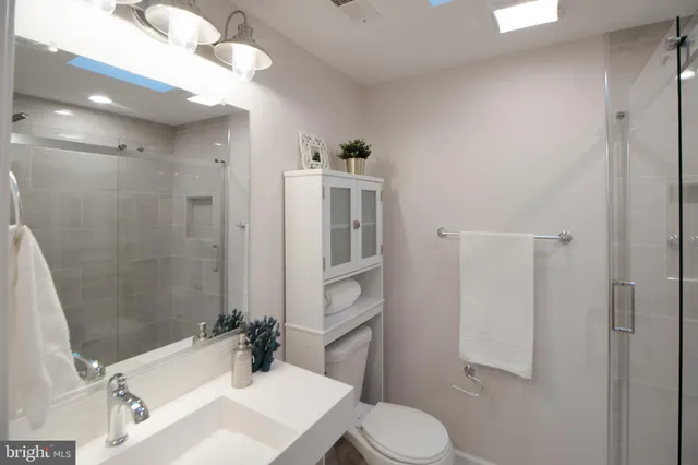a bathroom with a shower and toilet