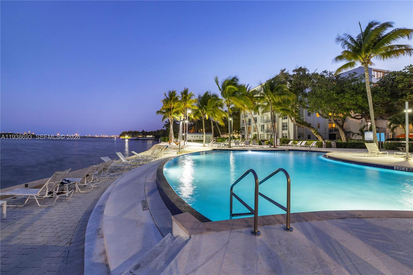 680 Northeast 64th Street, Unit APH2 Miami, FL 33138 - Photo 16 of 23 a view of a swimming pool with a chairs