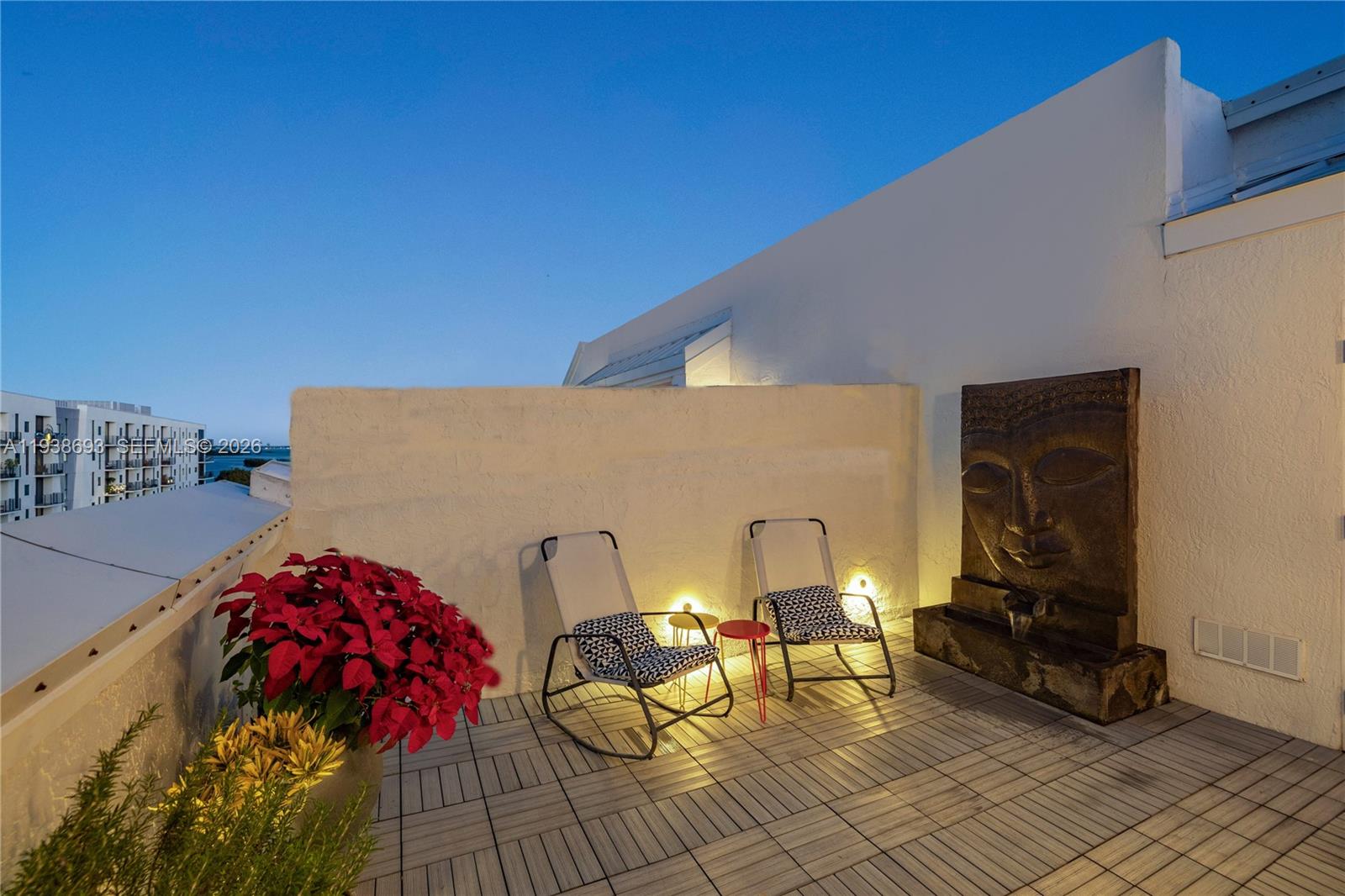 680 Northeast 64th Street, Unit APH2 Miami, FL 33138 - Photo 9 of 24 a view of a patio with table and chairs and potted plants