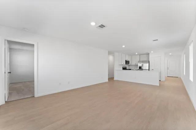 a view of a kitchen with a sink and a microwave