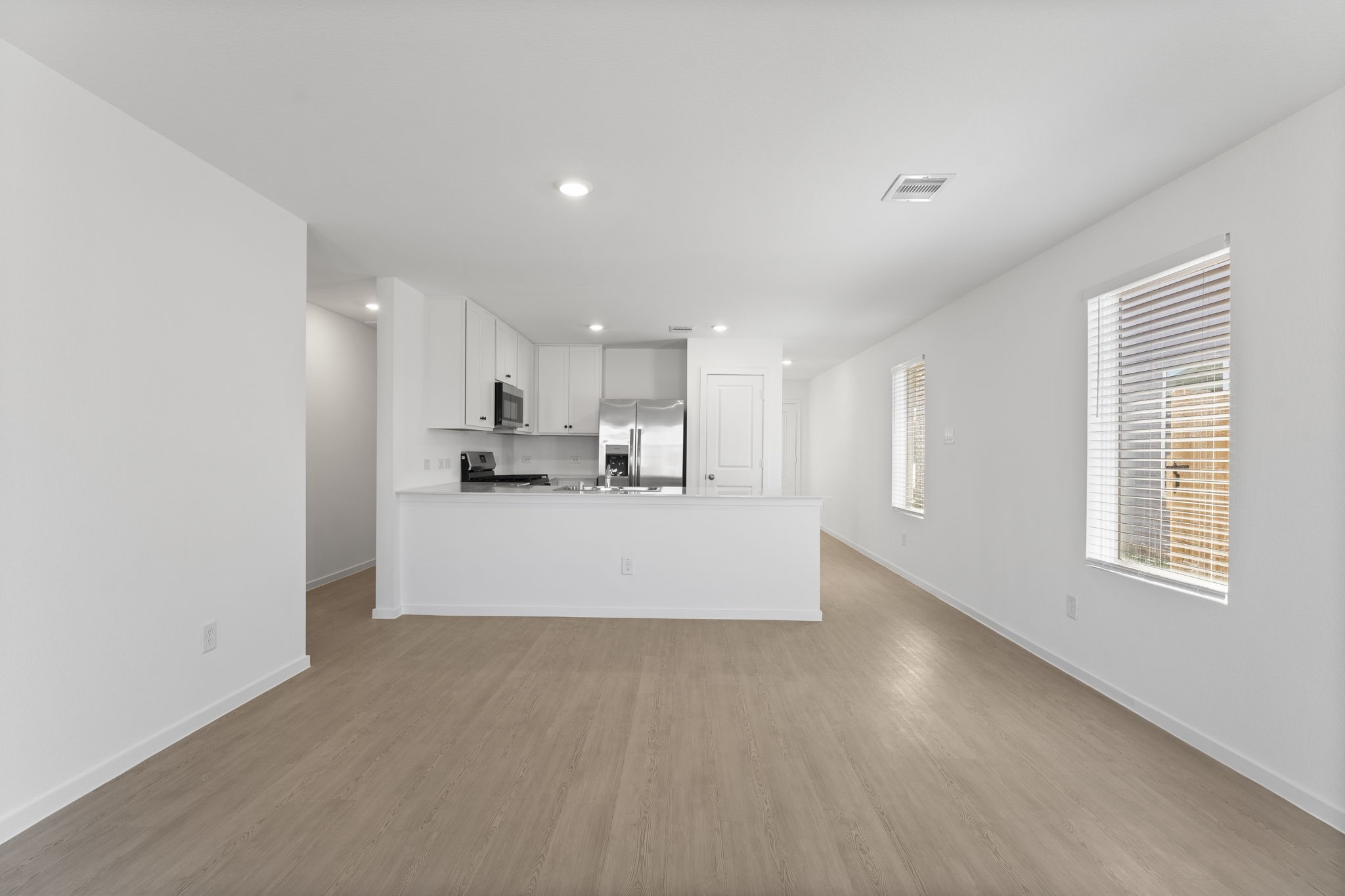 25392 Carnation Court Montgomery, TX 77316 - Photo 14 of 31 a view of kitchen with kitchen island white cabinets and stainless steel appliances
