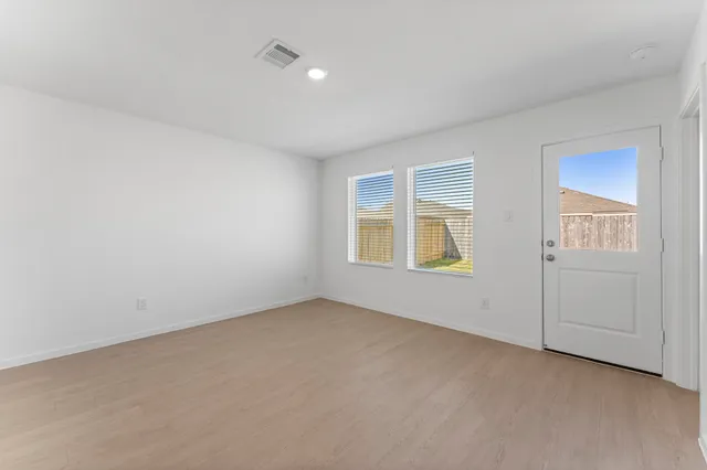 a view of an empty room and window