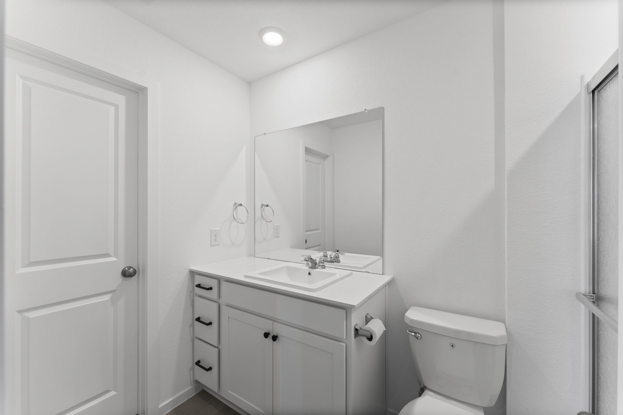 25392 Carnation Court Montgomery, TX 77316 - Photo 24 of 31 a bathroom with a toilet sink and mirror