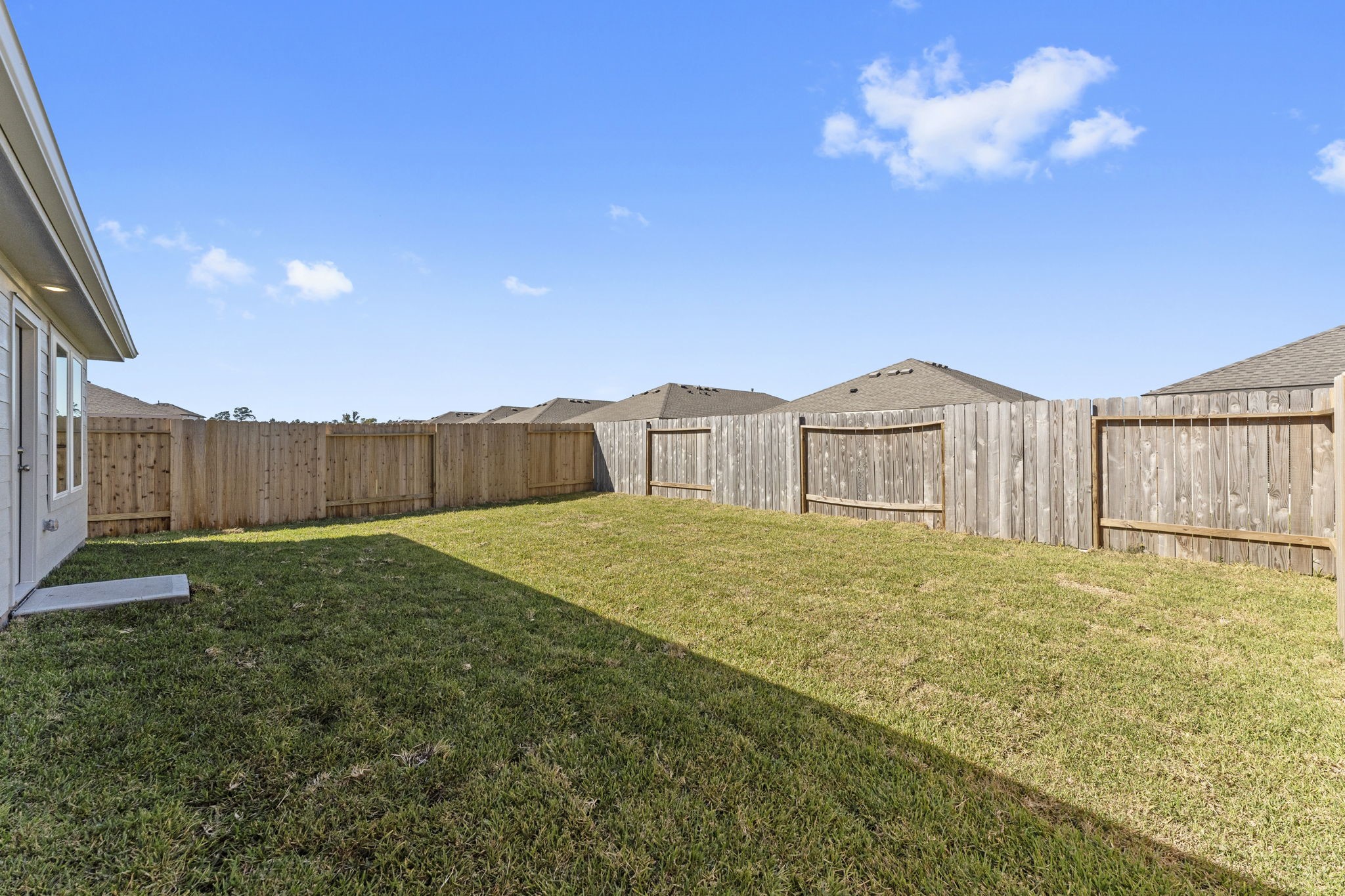 25392 Carnation Court Montgomery, TX 77316 - Photo 31 of 31 a view of backyard with wooden fence
