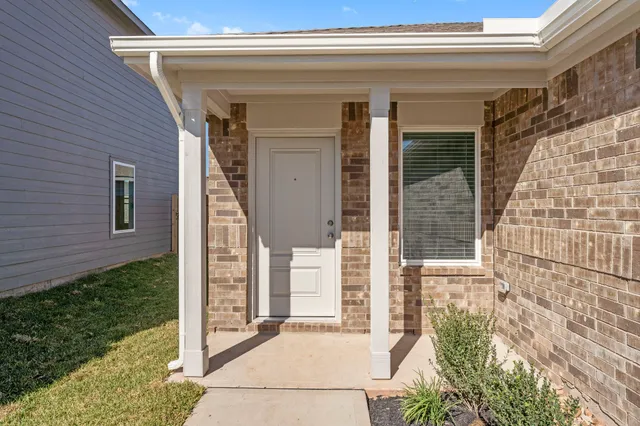 a view of a hallway with a room