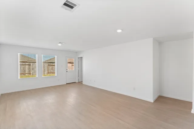 a view of a kitchen with a sink and cabinets