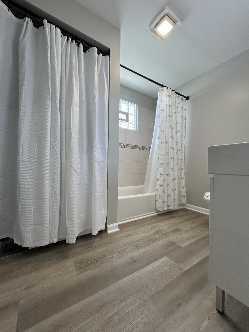 4834 North Ridgeway Avenue, Unit 3 Chicago, IL 60625 - Photo 6 of 12 a view of a room with window and gate
