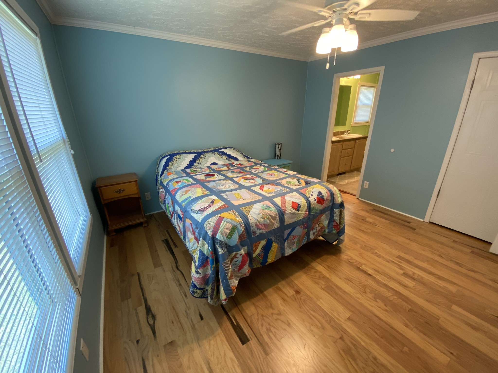 2808 Greer Road Goodlettsville, TN 37072 - Photo 20 of 37 a bedroom with a bed and a chandelier