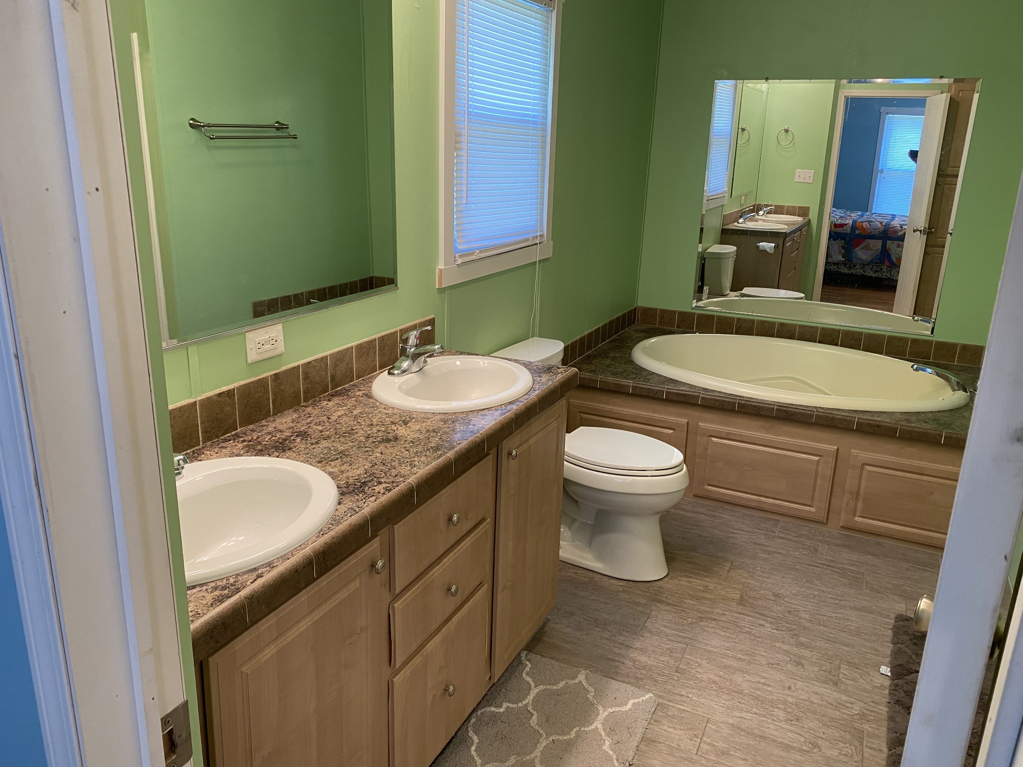 2808 Greer Road Goodlettsville, TN 37072 - Photo 21 of 37 a bathroom with a granite countertop toilet a sink and a mirror