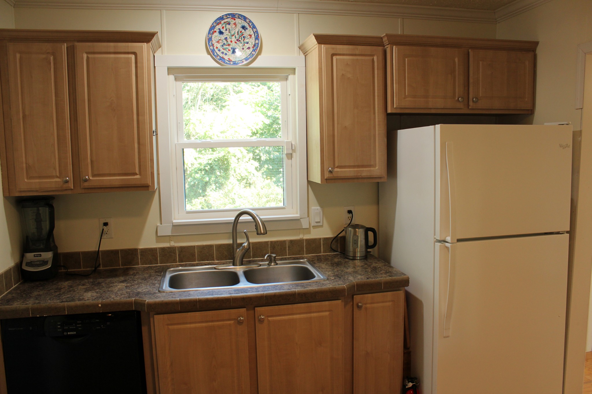2808 Greer Road Goodlettsville, TN 37072 - Photo 8 of 37 a kitchen with a refrigerator a sink and a window