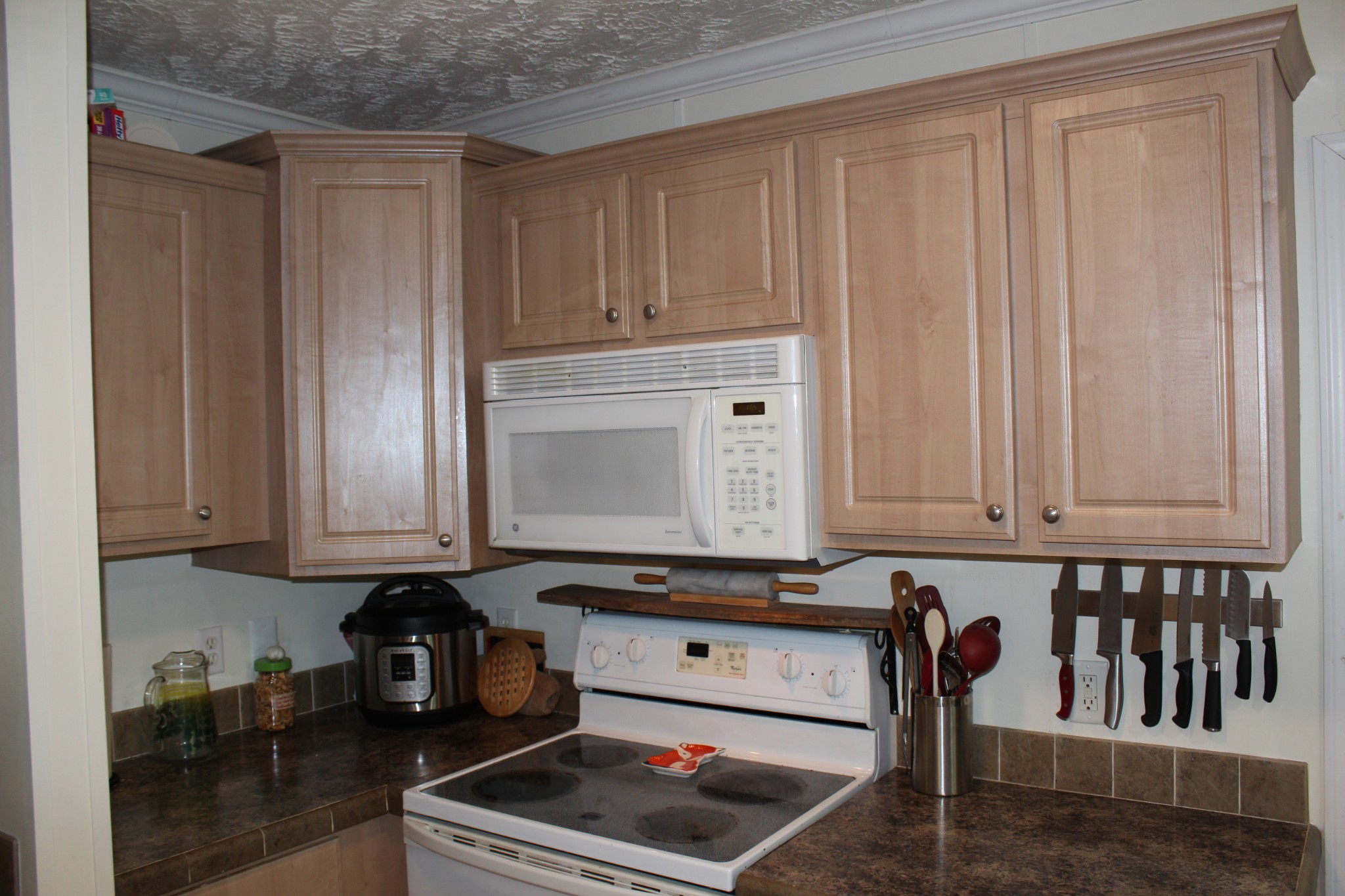 2808 Greer Road Goodlettsville, TN 37072 - Photo 9 of 37 a kitchen with granite countertop white cabinets and stainless steel appliances