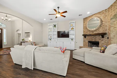 a living room with furniture and a fireplace