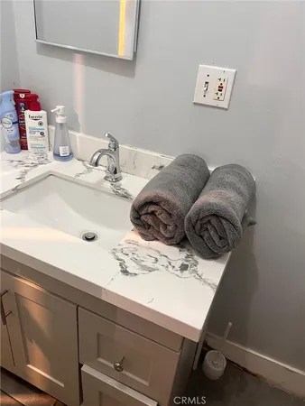 a bathroom with a sink and a mirror