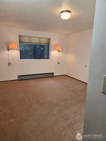 a white toilet sitting next to a small bathroom