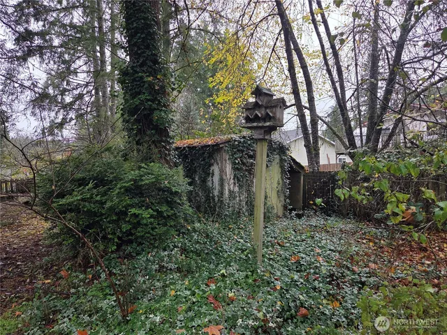 a backyard of a house with lots of green space
