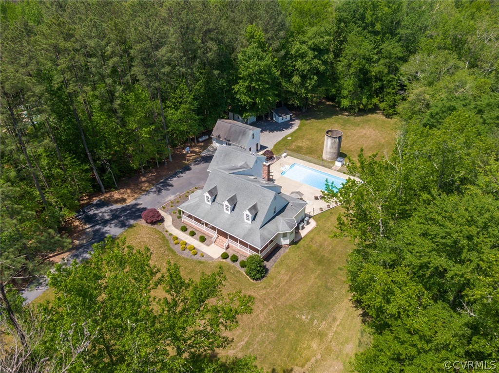 an aerial view of a house with a garden