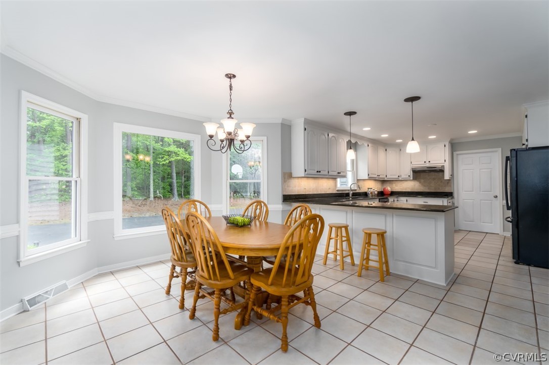 9820 Taylor Road Chesterfield, VA 23838 - Photo 14 of 40 a view of a dining room with furniture window and outside view