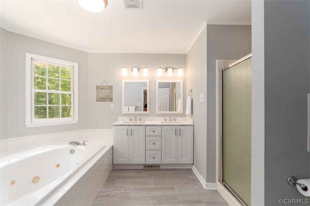 9820 Taylor Road Chesterfield, VA 23838 - Photo 29 of 40 a bathroom with a tub sink and mirror
