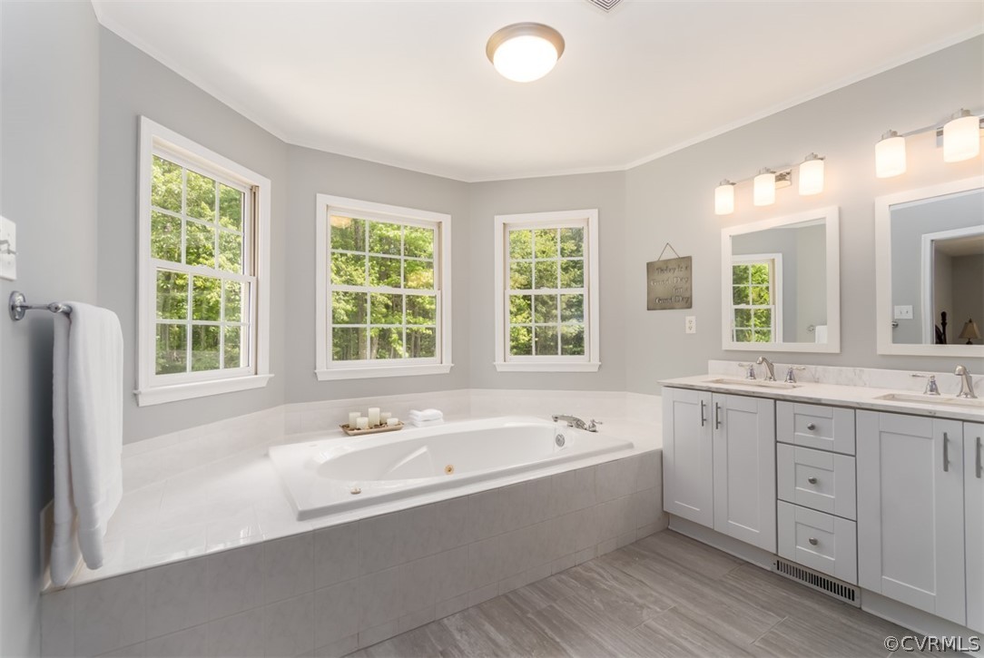 9820 Taylor Road Chesterfield, VA 23838 - Photo 30 of 40 a spacious bathroom with sink shower natural and mirror