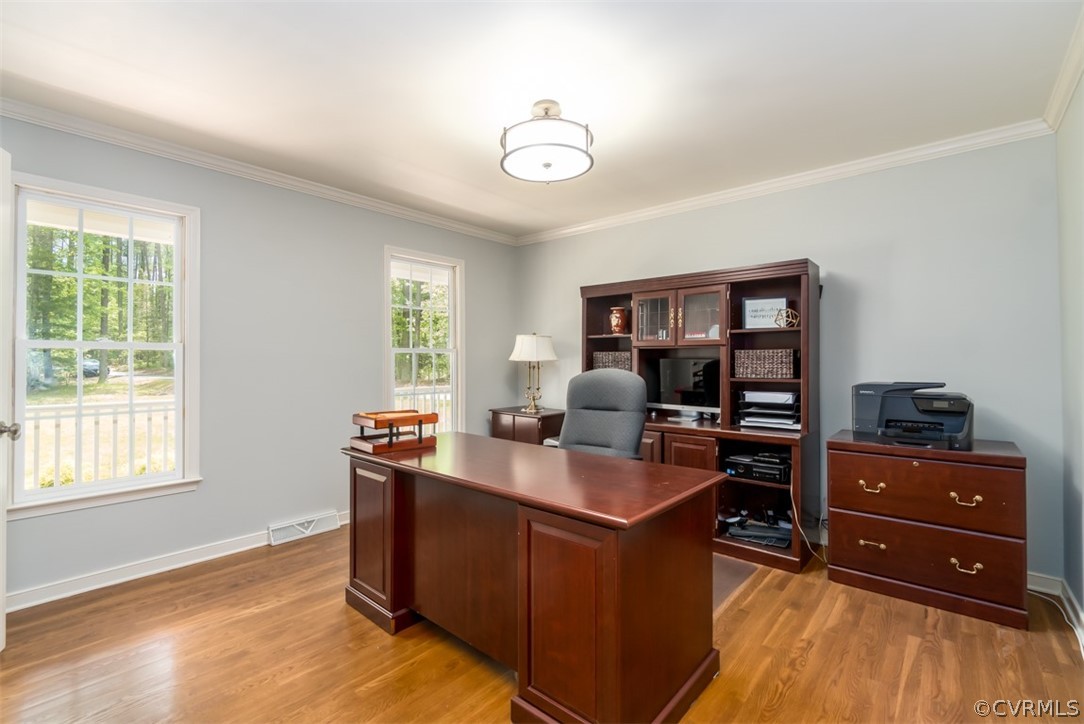 9820 Taylor Road Chesterfield, VA 23838 - Photo 6 of 40 a view of a workspace with furniture and a window