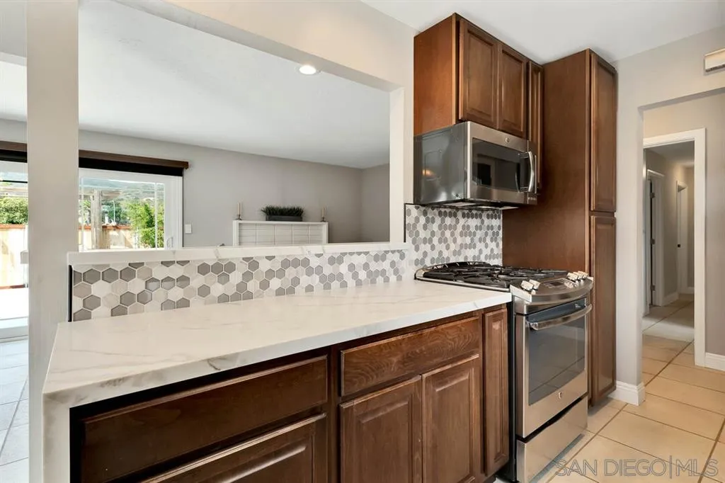 13420 Frame Road Poway, CA 92064 - Photo 8 of 25 a kitchen with a stove and a microwave