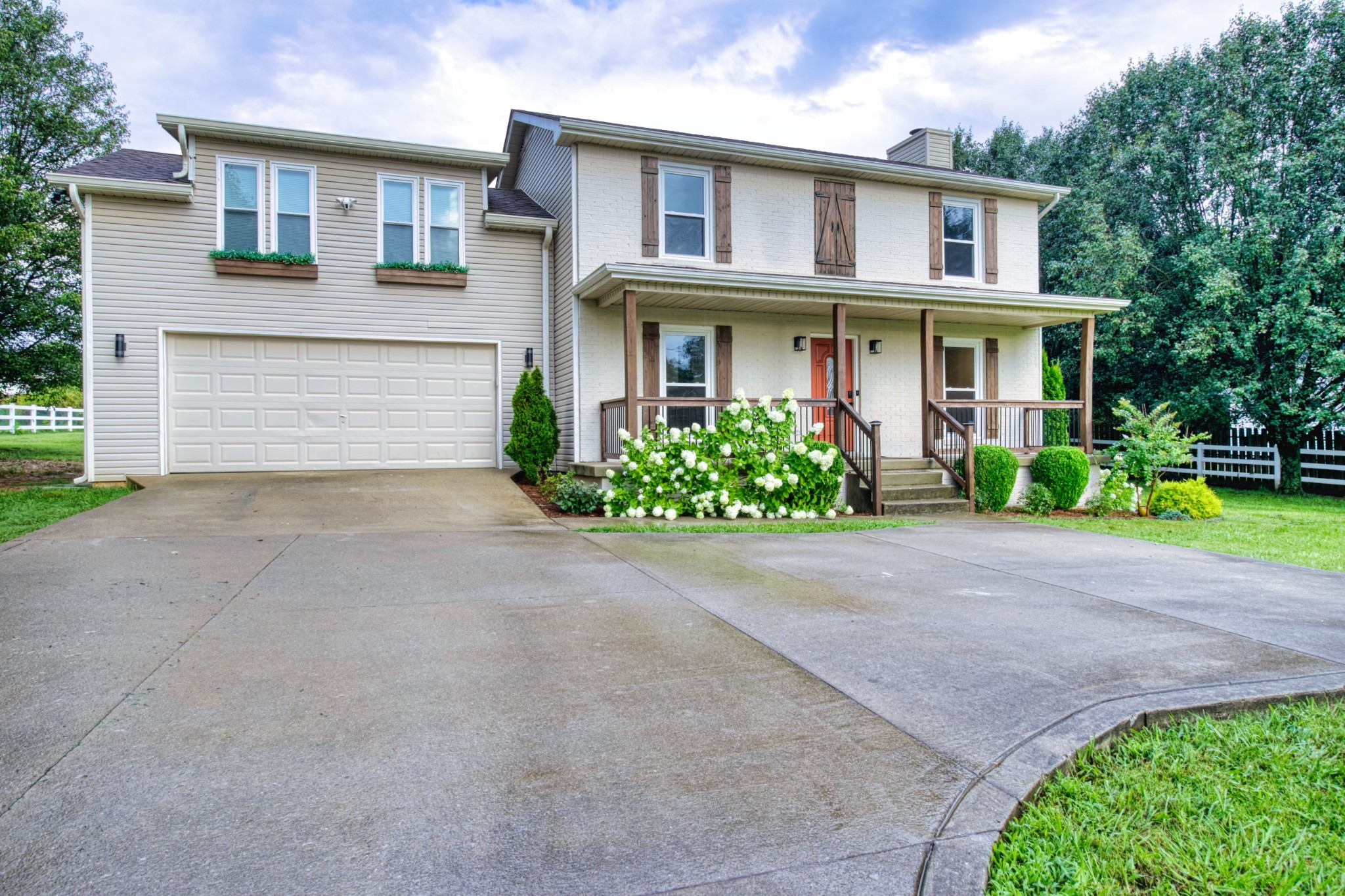 1349 Bates Road Lebanon, TN 37087 - Photo 1 of 29 a front view of a house with a yard and a garage
