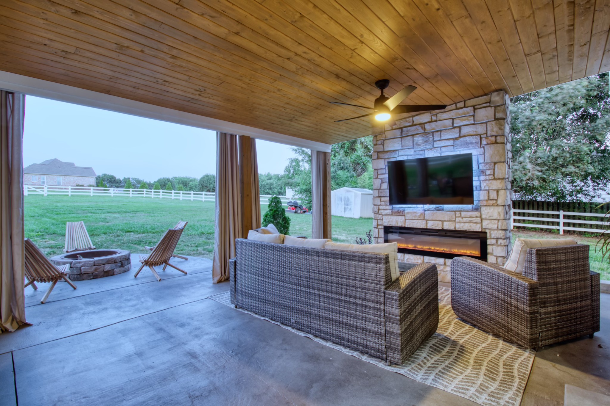 1349 Bates Road Lebanon, TN 37087 - Photo 29 of 29 a living room with couches a flat screen tv and a table