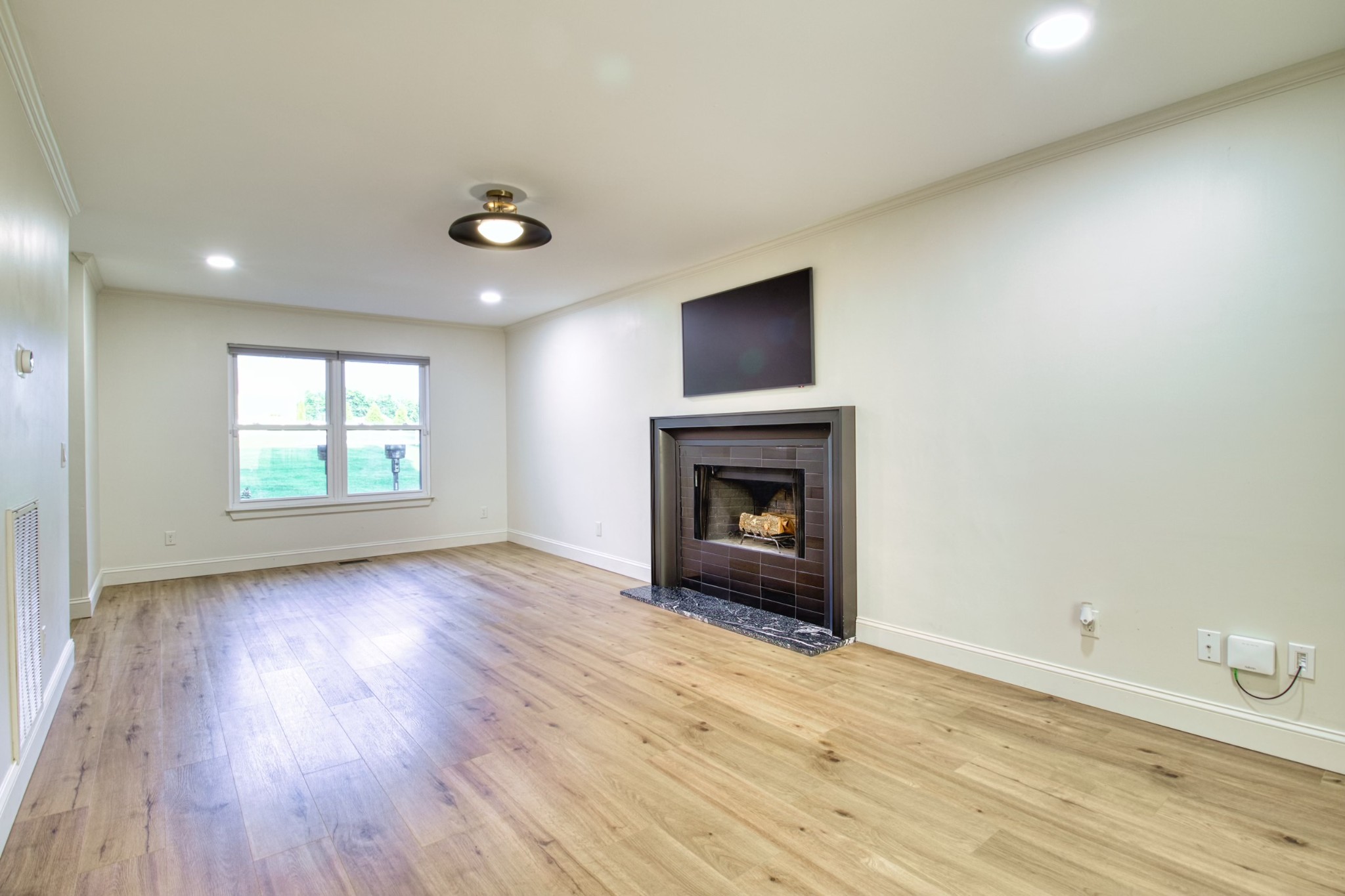 1349 Bates Road Lebanon, TN 37087 - Photo 7 of 29 an empty room with windows and fireplace