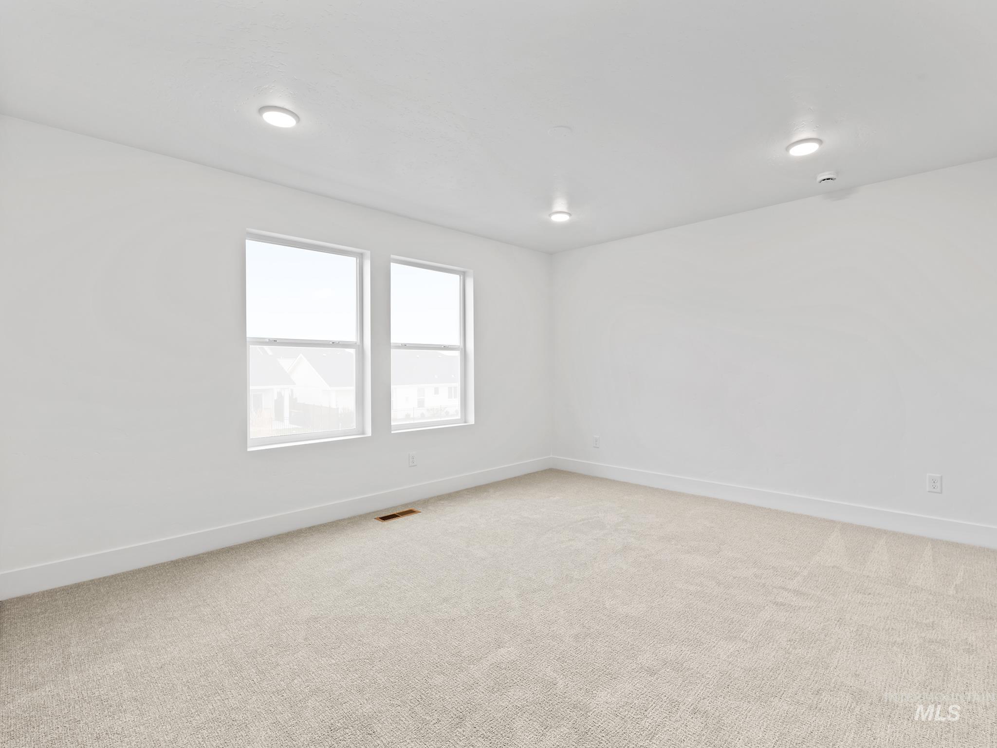 6369 South Sachet Avenue Meridian, ID 83642 - Photo 7 of 13 Unfurnished room with light colored carpet