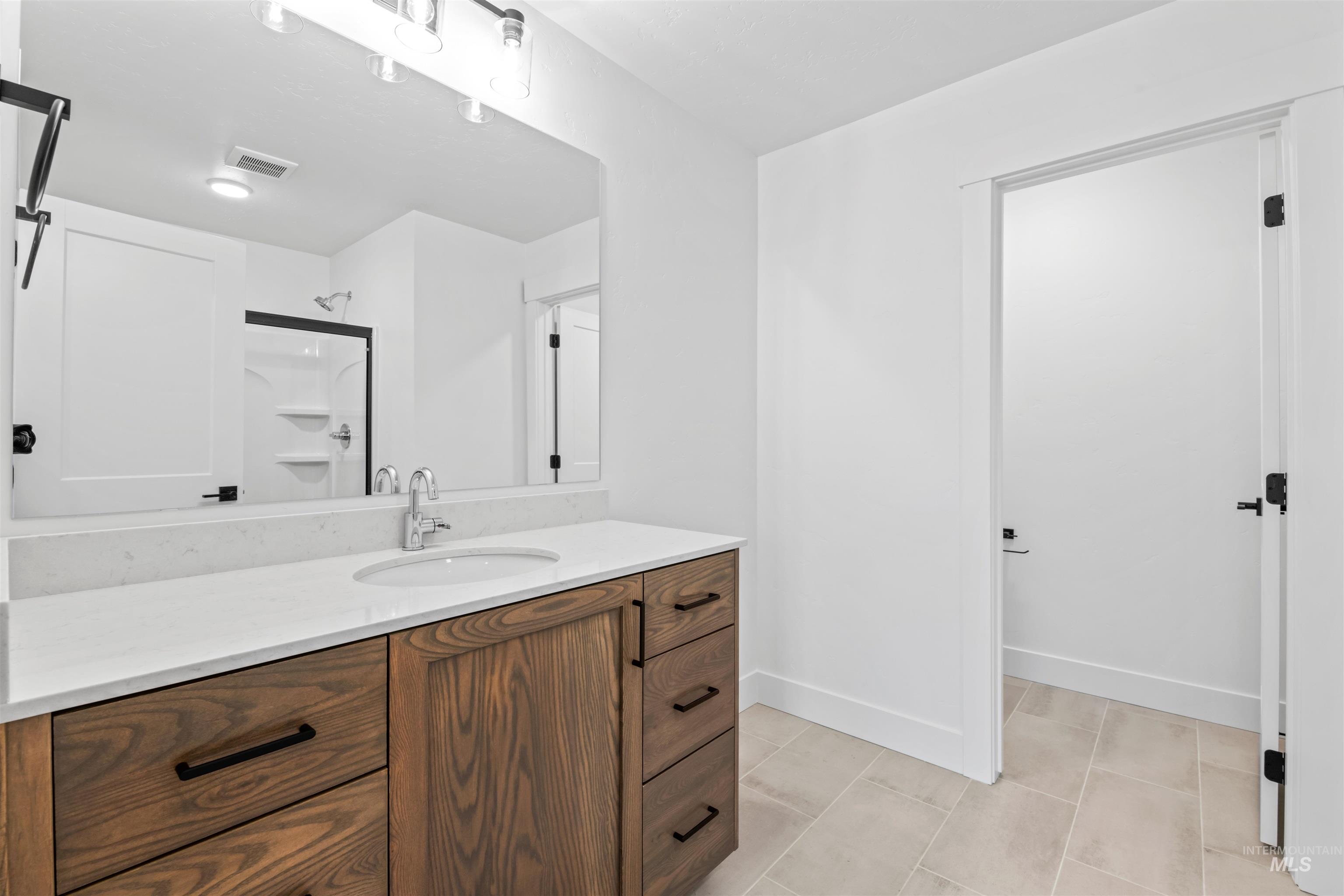 6369 South Sachet Avenue Meridian, ID 83642 - Photo 8 of 13 Full bath with a stall shower and vanity