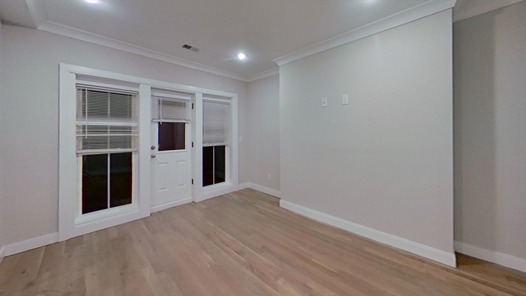 47 Englewood Avenue, Unit 5 Boston, MA 02135 - Photo 5 of 7 an empty room with windows