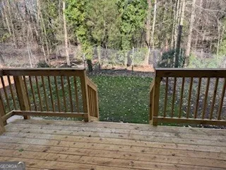 a view of entryway with wooden fence