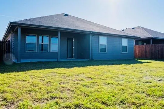 a house view with a backyard