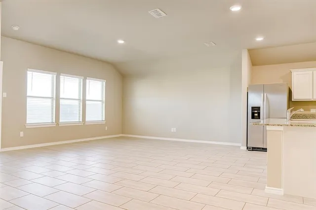 a view of a kitchen with a sink and a window
