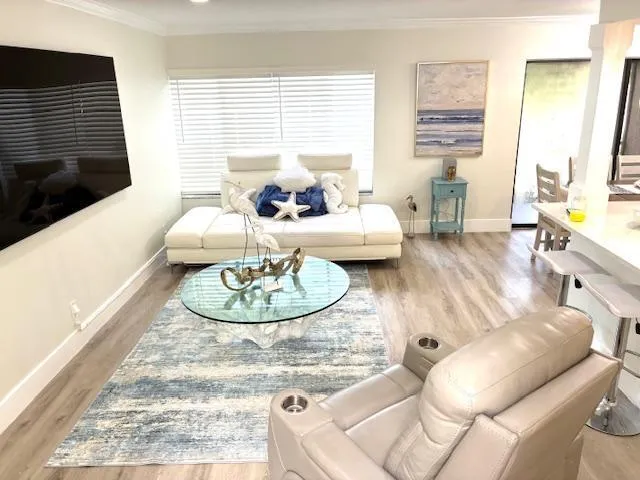 a living room with furniture and a table