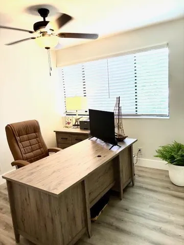 a room with a bed and a desk