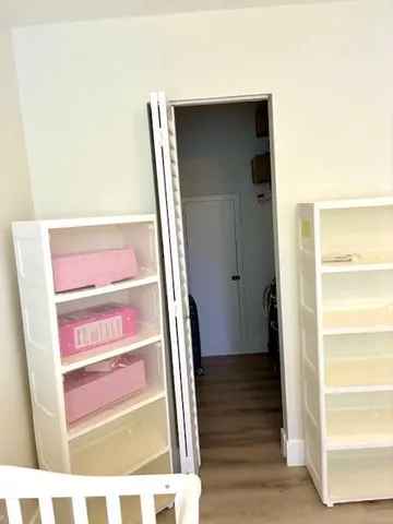 a view of front door with wooden floor