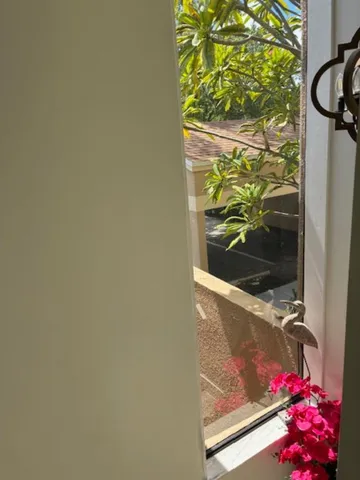 a view of a room with wooden floor and a balcony