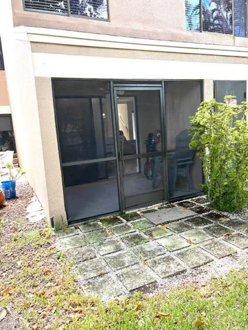 a pathway of a house with a yard