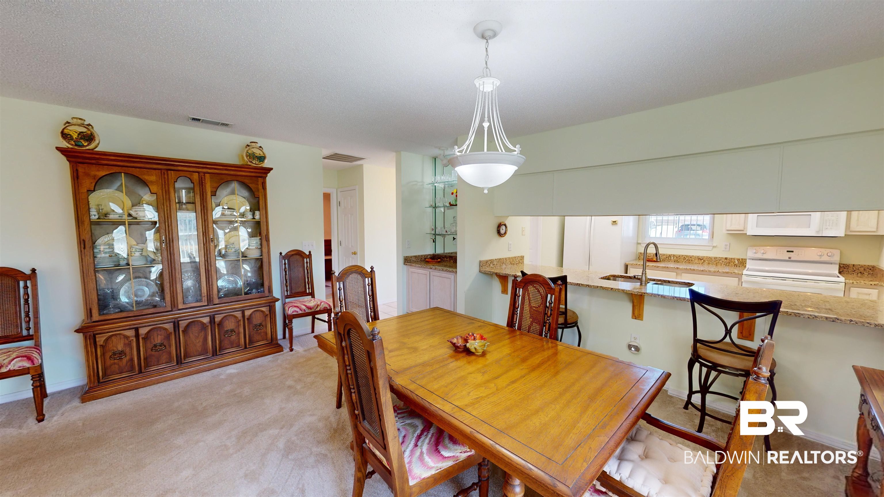 9445 Villas Drive Foley, AL 36535 - Photo 7 of 20 Carpeted dining space featuring sink