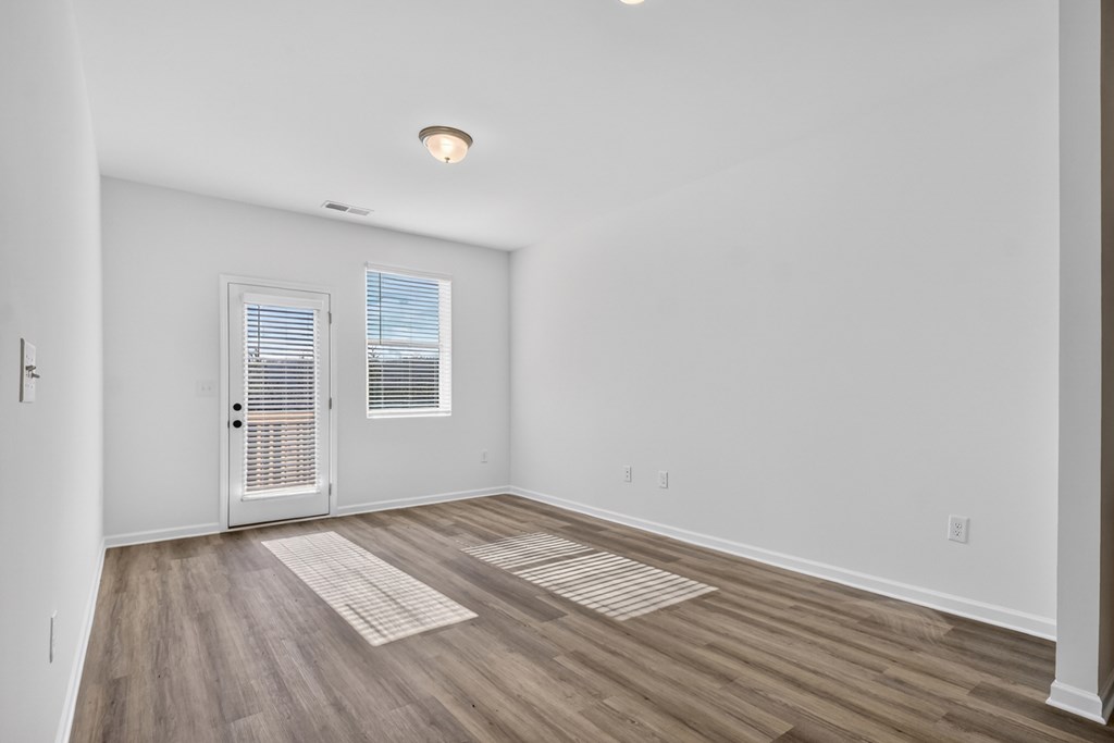 7 Grove Loop Blue Ridge, GA 30513 - Photo 13 of 33 a view of empty room with wooden floor and fan