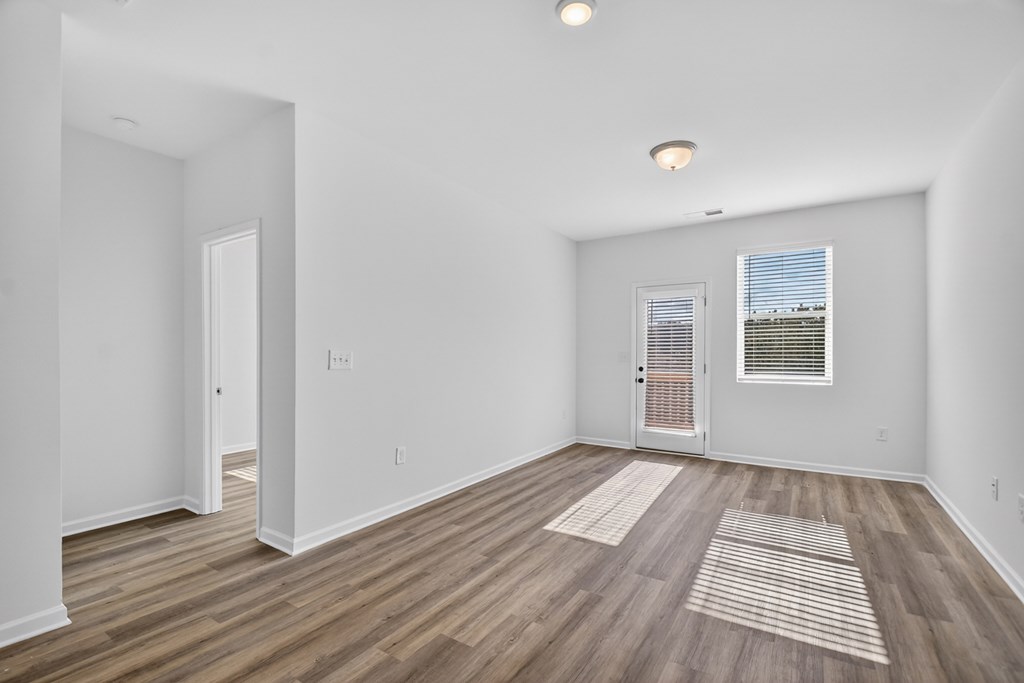 7 Grove Loop Blue Ridge, GA 30513 - Photo 14 of 33 a view of an empty room with wooden floor and a window
