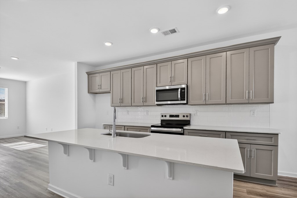 7 Grove Loop Blue Ridge, GA 30513 - Photo 18 of 33 a kitchen with stainless steel appliances a sink stove and cabinets