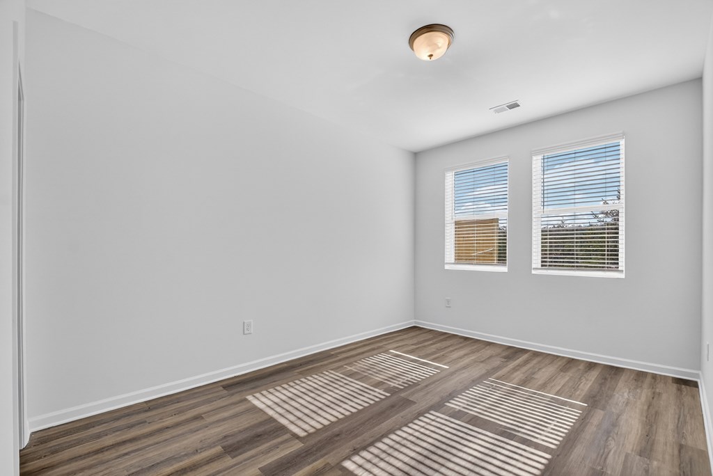 7 Grove Loop Blue Ridge, GA 30513 - Photo 28 of 33 an empty room with wooden floor and windows