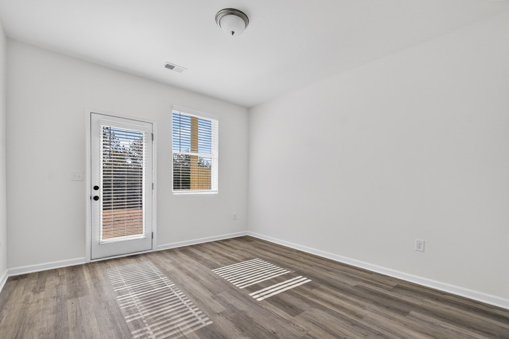 7 Grove Loop Blue Ridge, GA 30513 - Photo 29 of 33 a view of an empty room with wooden floor and a window