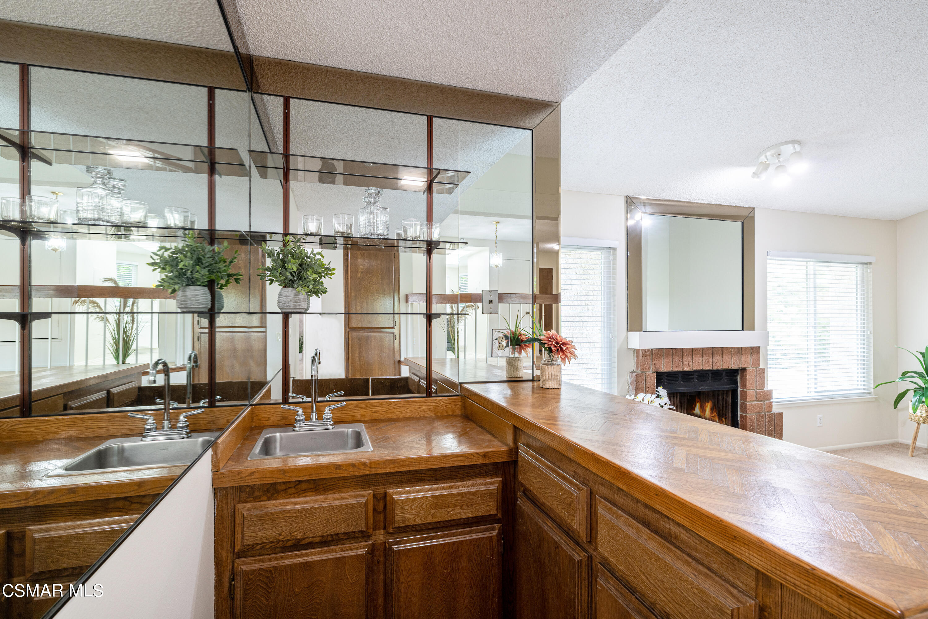 3330 Darby Street, Unit 409 Simi Valley, CA 93063 - Photo 12 of 27 a kitchen with a sink and a counter top space