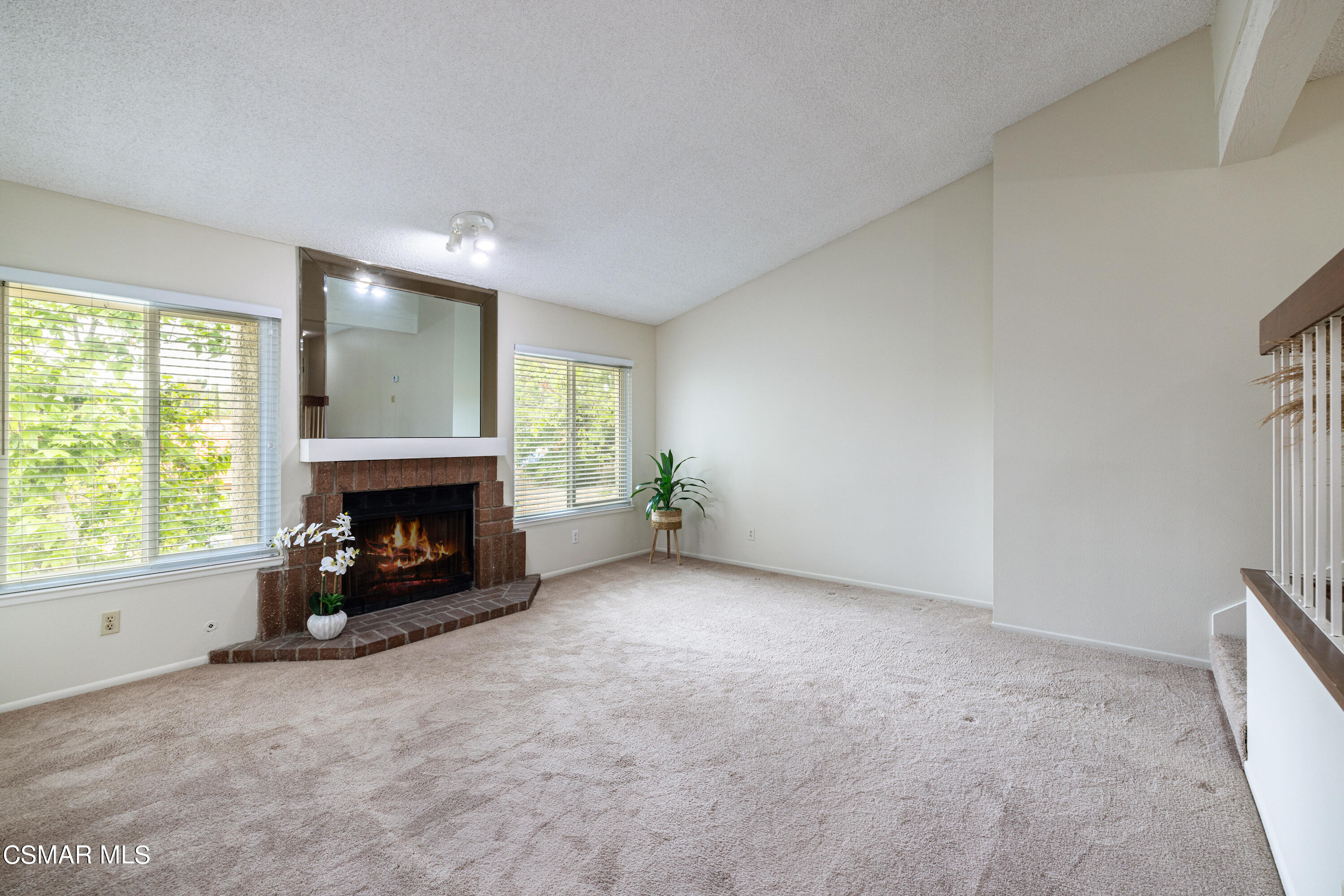 3330 Darby Street, Unit 409 Simi Valley, CA 93063 - Photo 13 of 27 an empty room with furniture and a fireplace